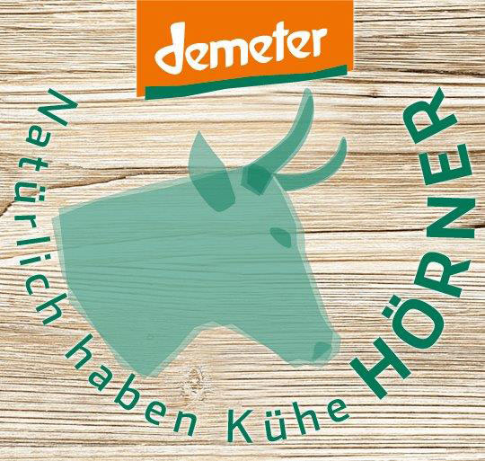 Demeter Logo mit gehörnter Kuh-Illustration